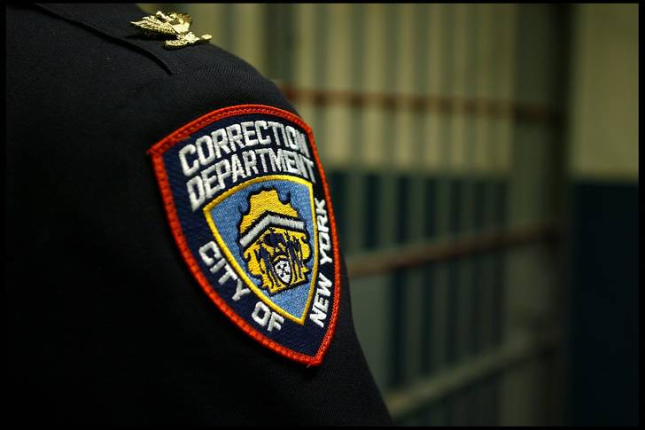 A Correction Department badge on an officer at the Vernon C. Bain Correctional Center at Rikers Island, in the Bronx.